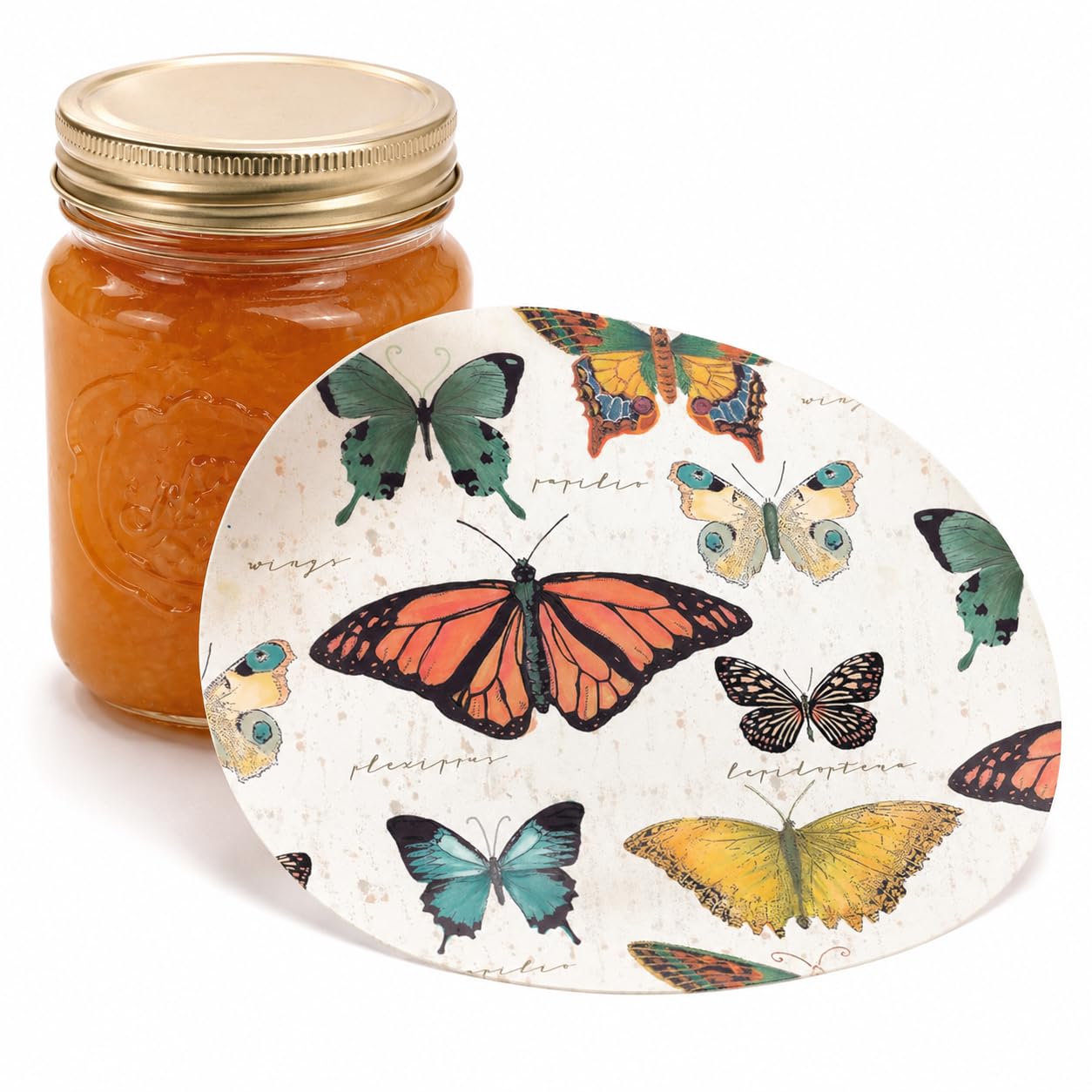 Butterfly-printed silicone jar opener disc displayed beside a glass jar of orange preserves