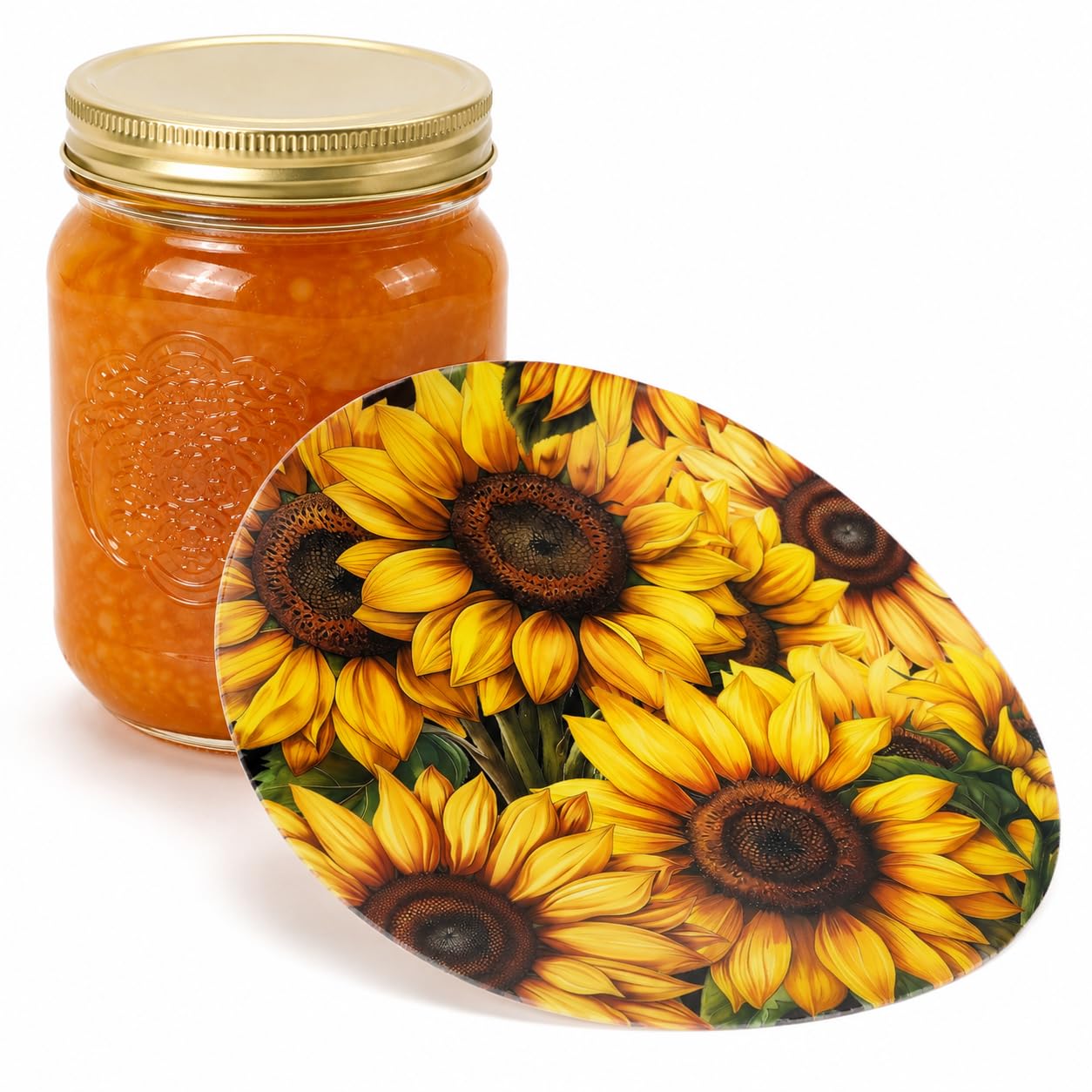 Sunflower-patterned silicone jar opener beside a mason jar filled with orange preserves