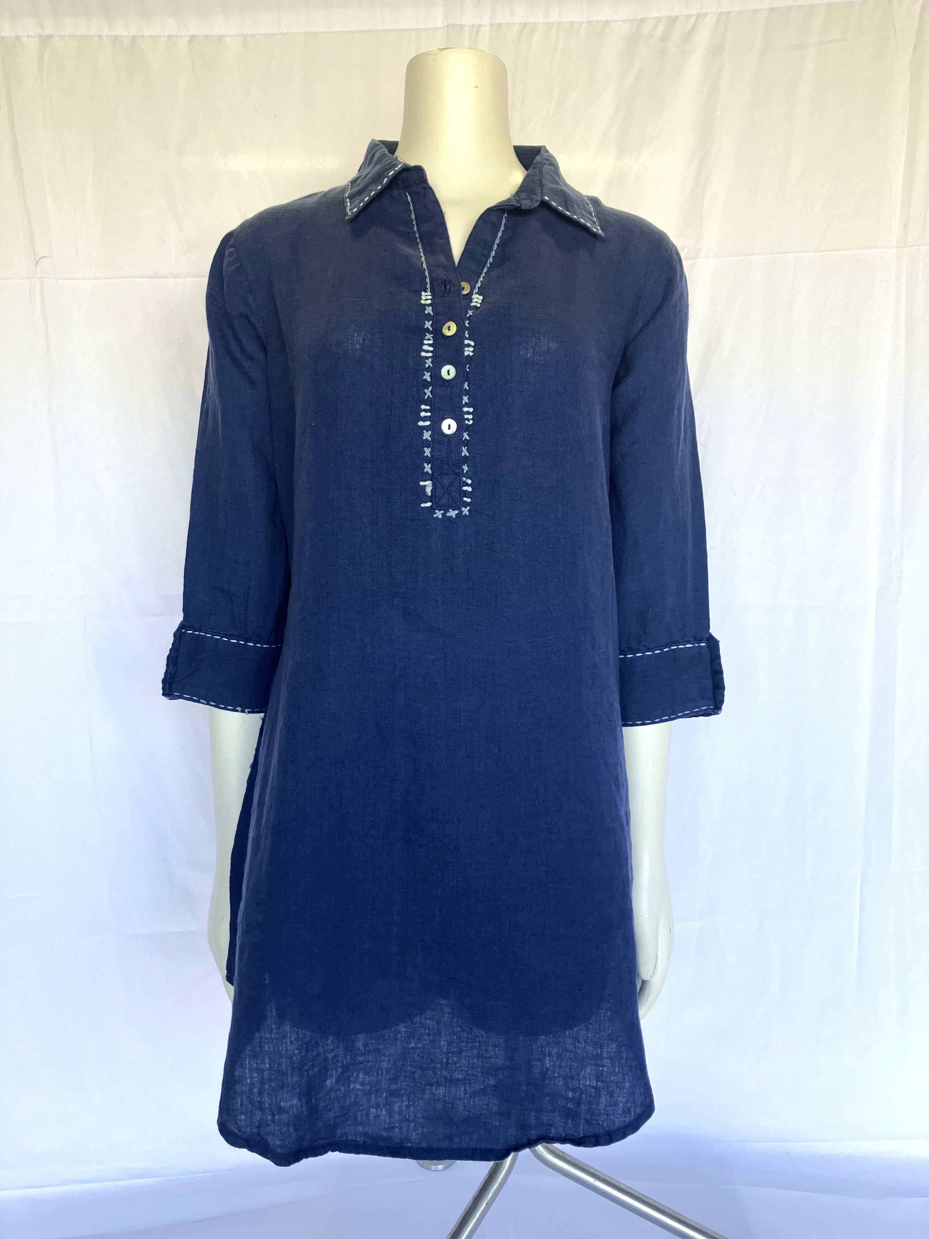 Navy linen tunic dress on mannequin with button placket and white contrast stitching details