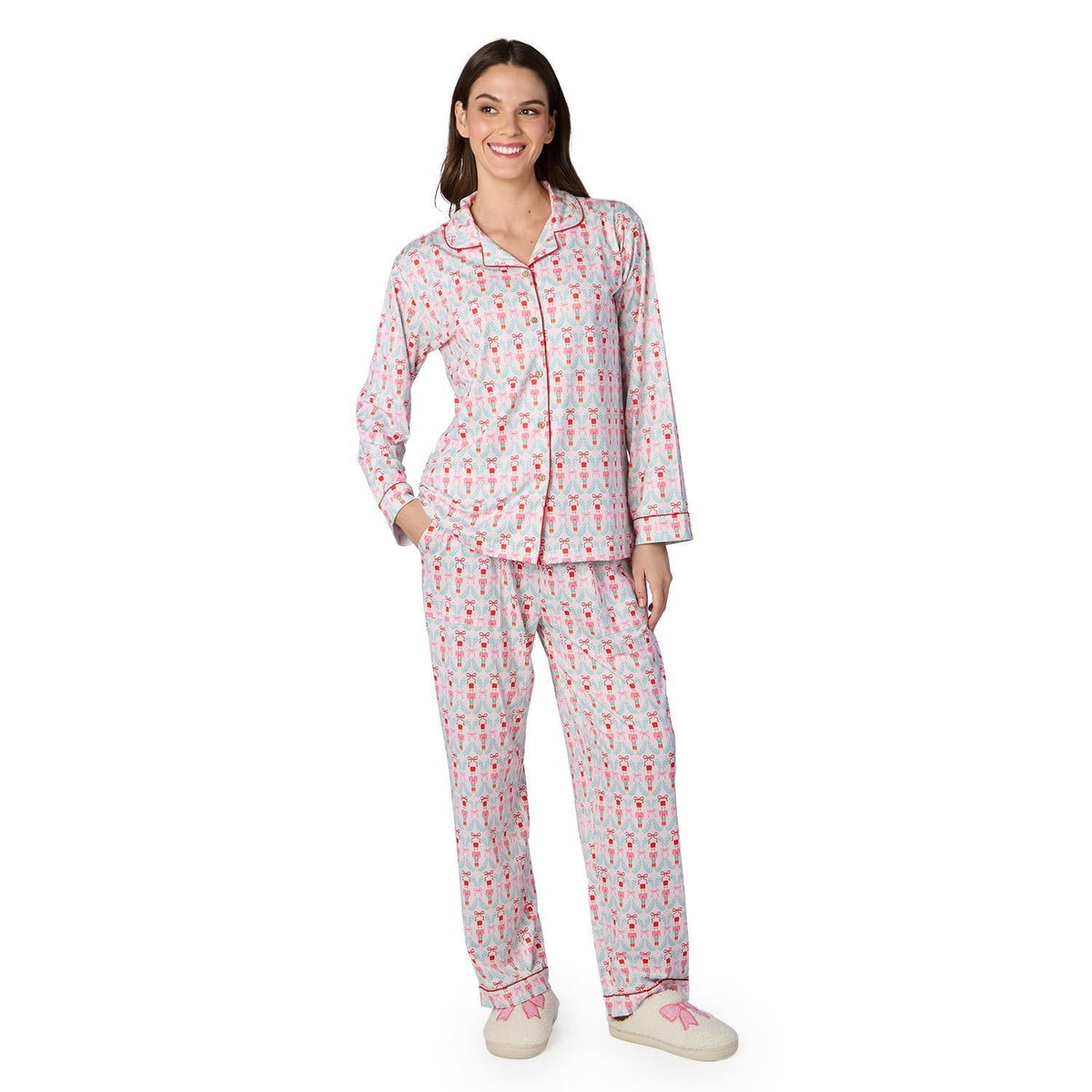 Woman modeling pink and grey nutcracker print long sleeve pajama set with matching pants