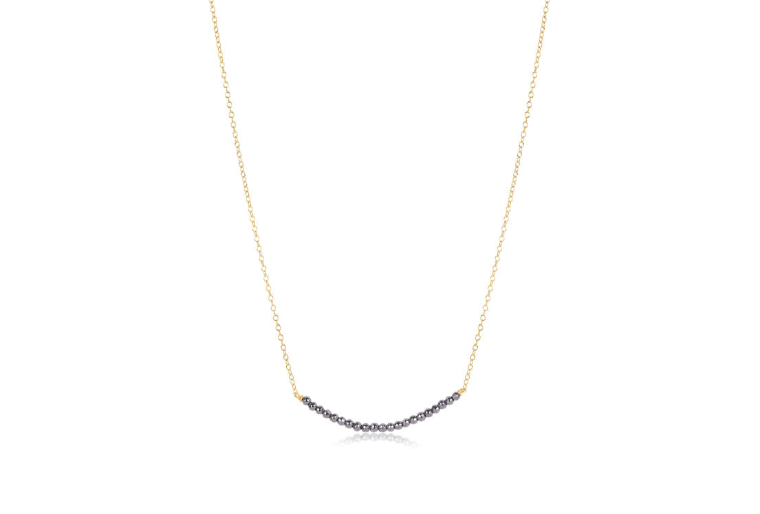 16-inch gold chain necklace with curved silver faceted hematite beaded bar centerpiece