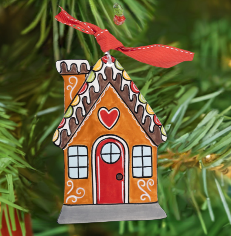 Glory Haus gingerbread house flat ornament with red ribbon hanging on Christmas tree