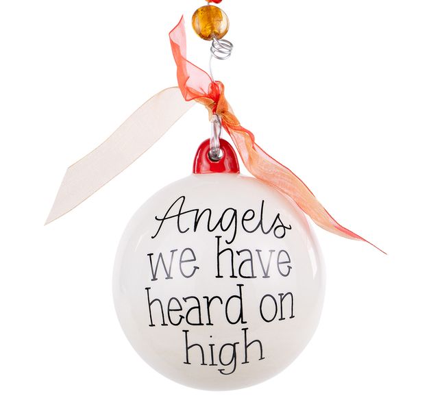 White ceramic Christmas ornament reading Angels We Have Heard on High with red ribbon