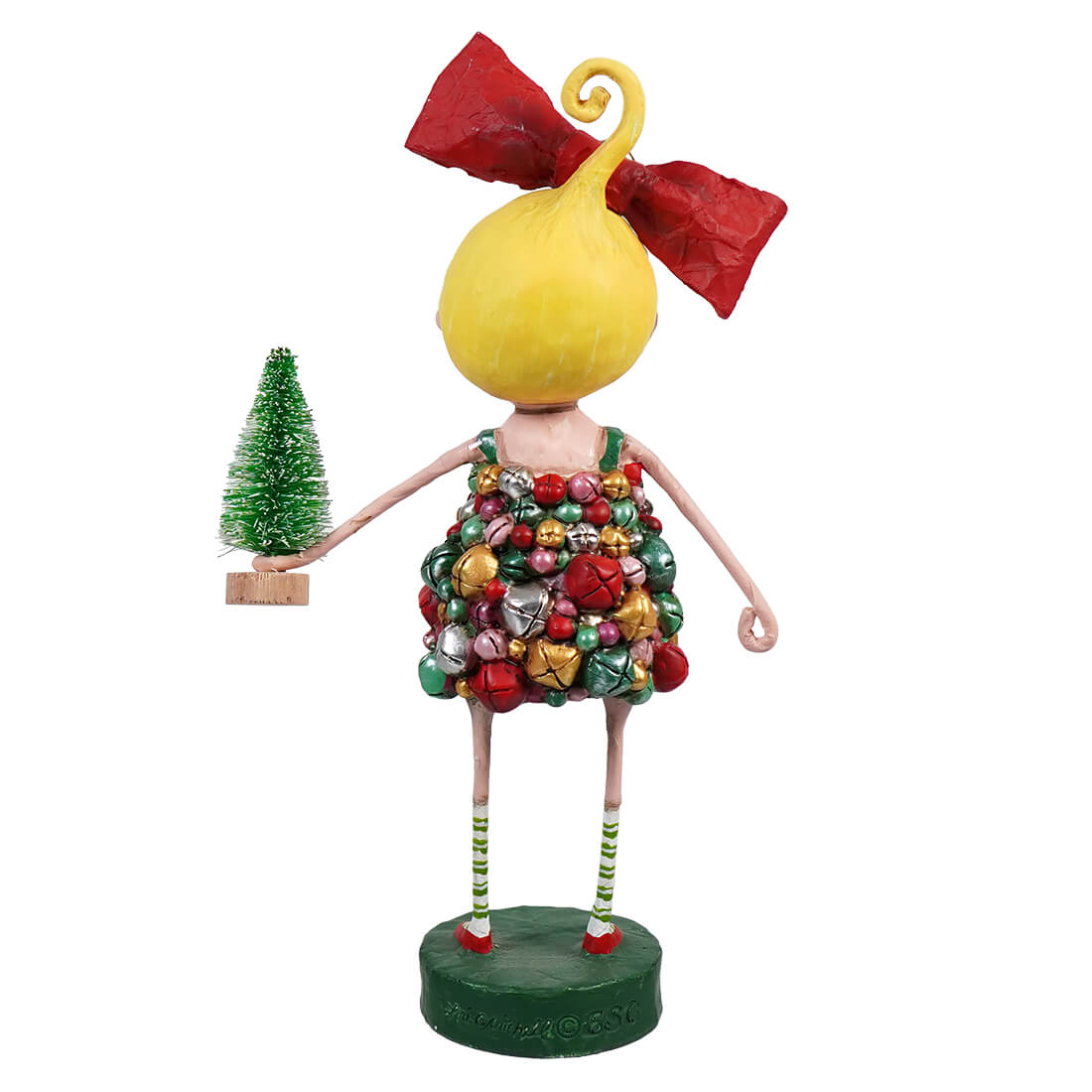 Back view of Jingle Belle figurine with jingle bell dress, red bow, and miniature Christmas tree