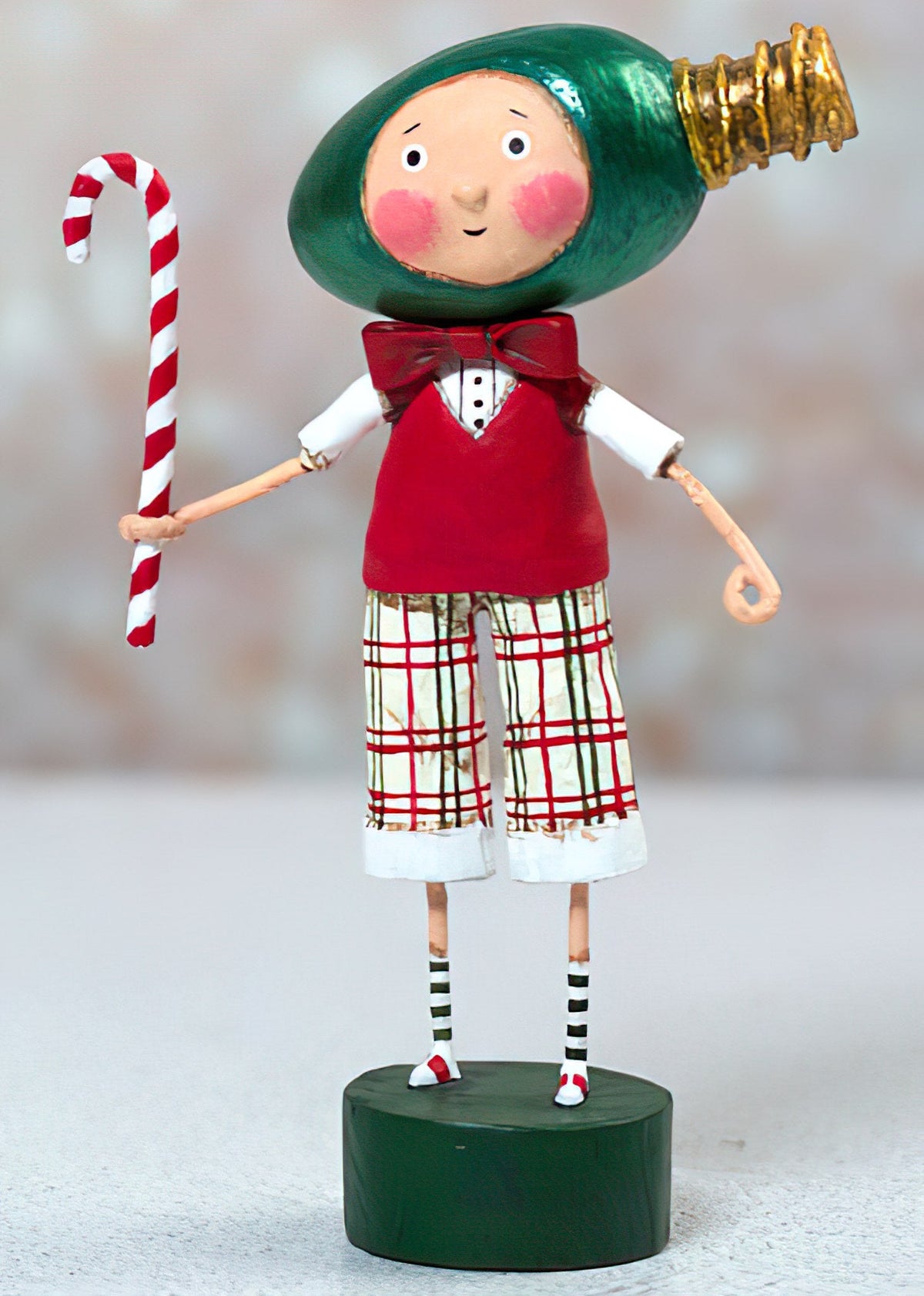 Lori Mitchell All Aglow figurine with Christmas bulb head holding a candy cane
