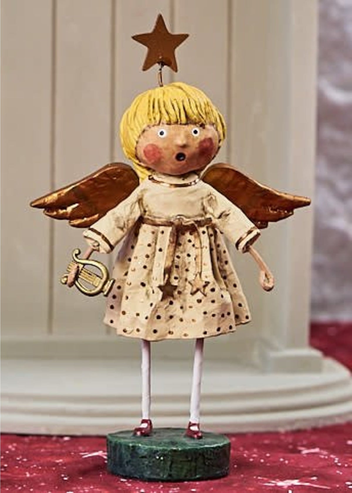 Lori Mitchell angel figurine with blonde hair, brown wings, polka dot dress, holding a lyre