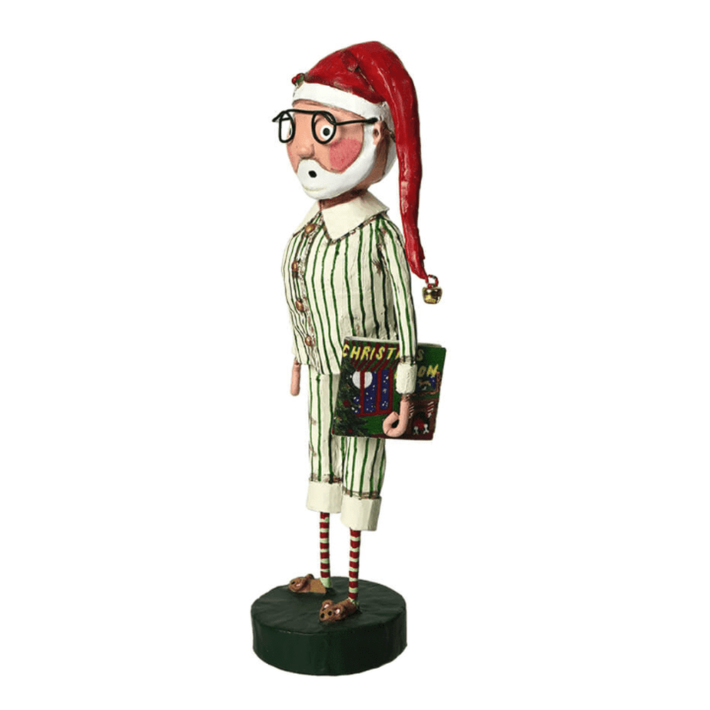 Lori Mitchell Storytime Santa figurine in striped pajamas holding a Christmas book