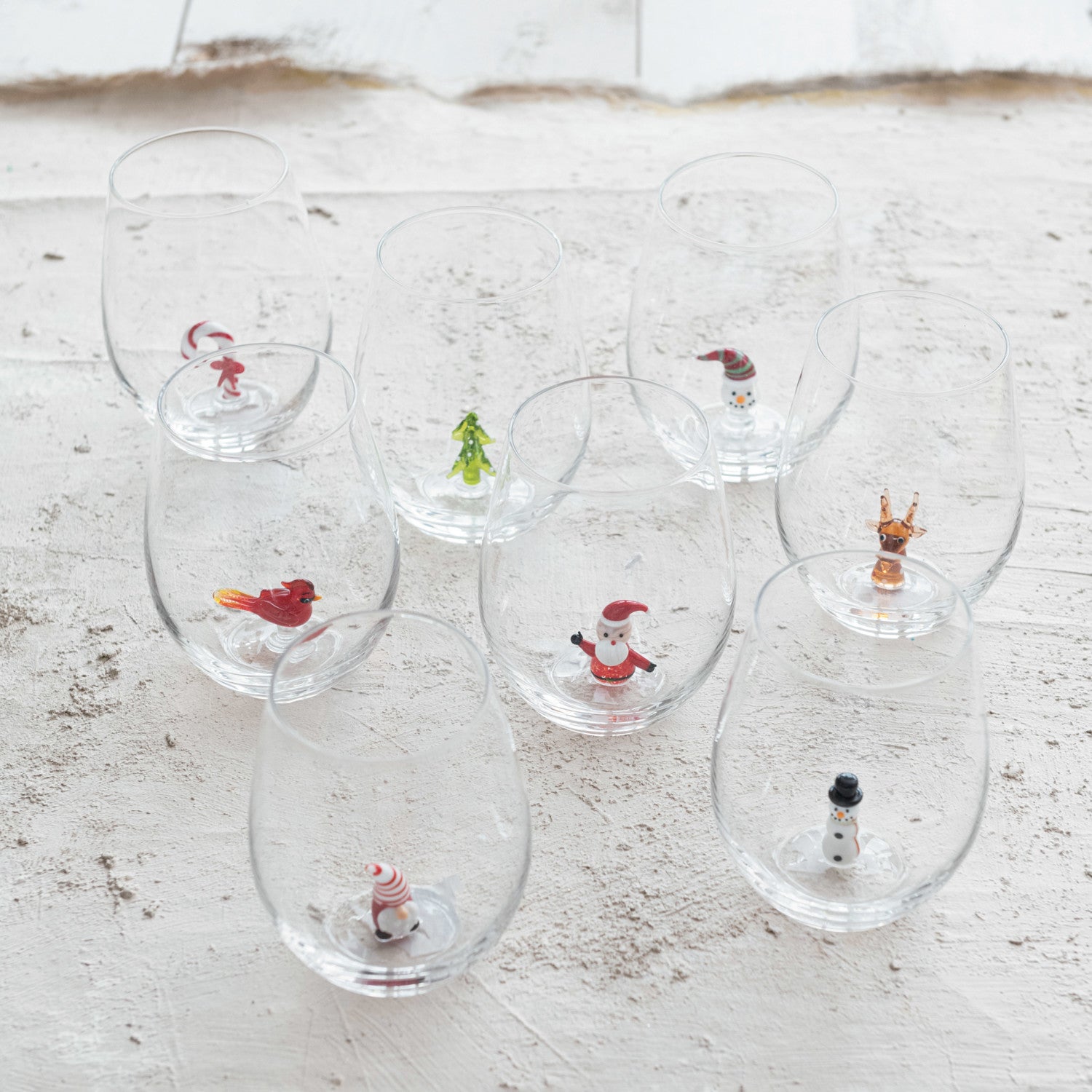 STEMLESS WINE GLASS W/HOLIDAY FIGURINE