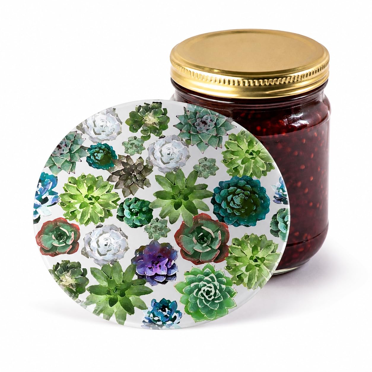 Succulent-patterned silicone jar opener disc leaning against a jam jar with gold lid