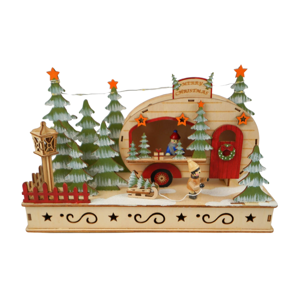 Lighted wooden Christmas camper scene with trees, figures, and Merry Christmas sign