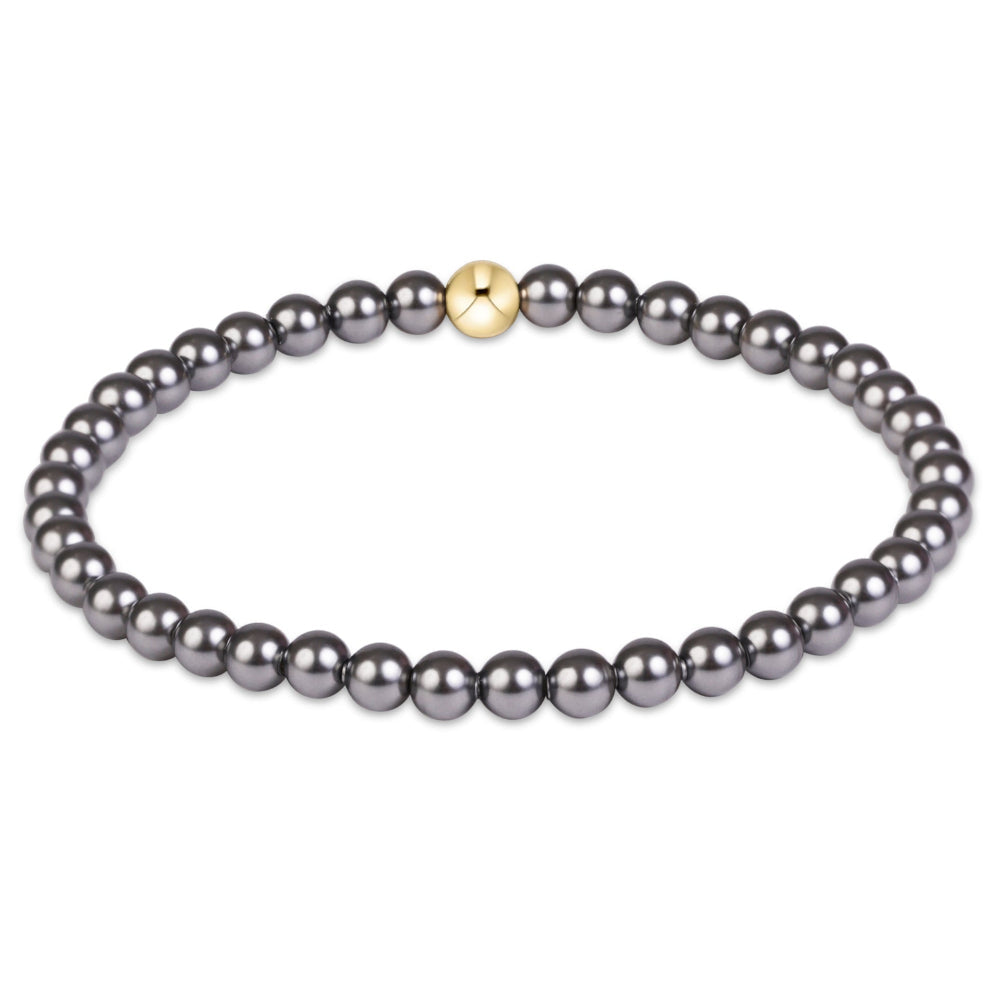 Classic dark grey 4mm pearl bracelet with single gold bead accent by eNewton