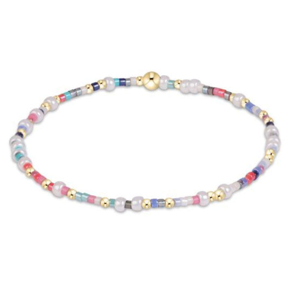 eNewton Hope Unwritten bracelet with multicolor seed beads, freshwater pearls, and gold beads on white background