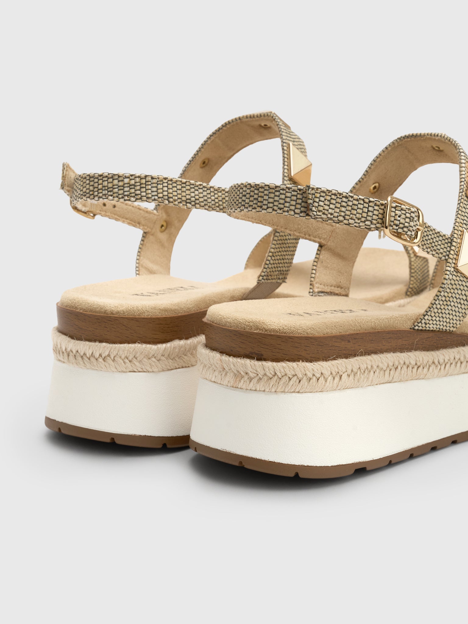 Back view of camel woven platform espadrille sandals with gold buckle ankle strap