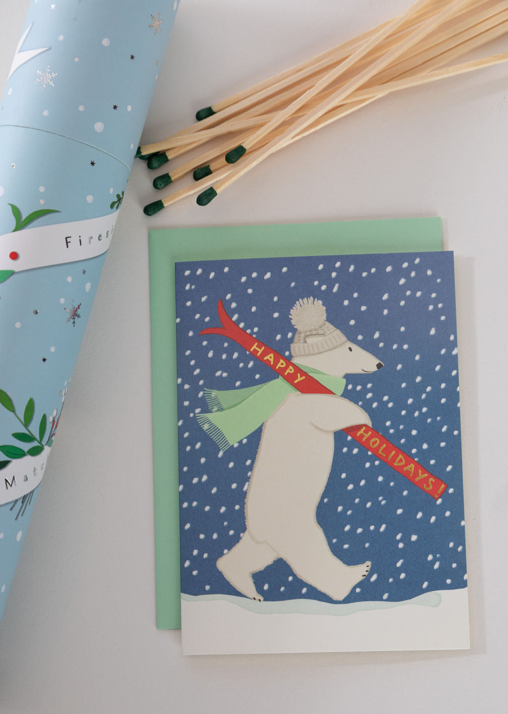 Karen Adams Designs polar bear Happy Holidays greeting card with green envelope and fireplace matches
