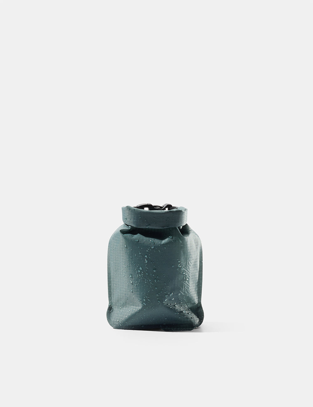 Matador FlatPak Soap Bar Case in Juniper green with roll-top closure and water droplets