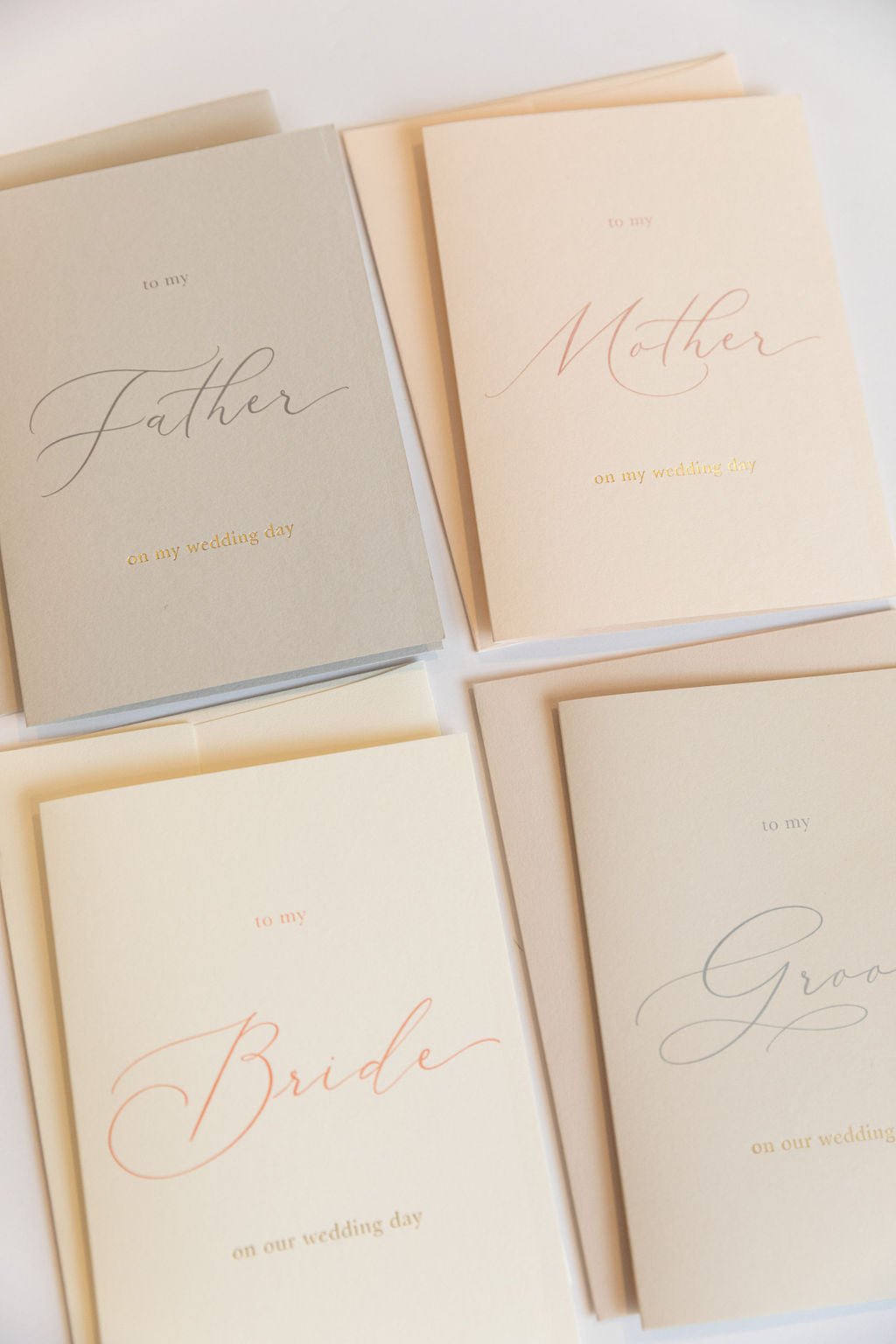 Four wedding day greeting cards including To My Father, Mother, Bride, and Groom on neutral backgrounds