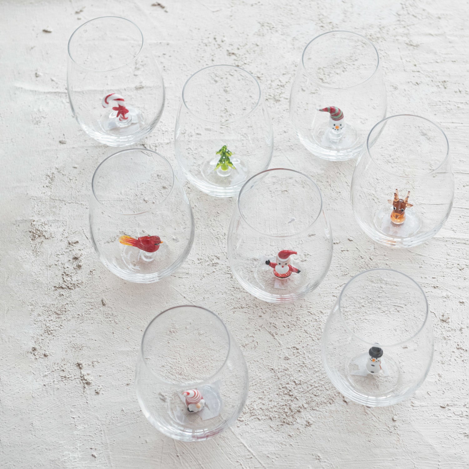 STEMLESS WINE GLASS W/HOLIDAY FIGURINE